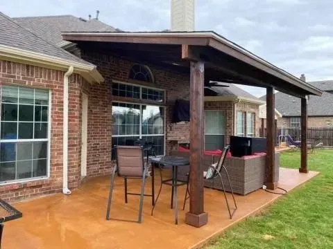 Wood patio cover over an outdoor seating area